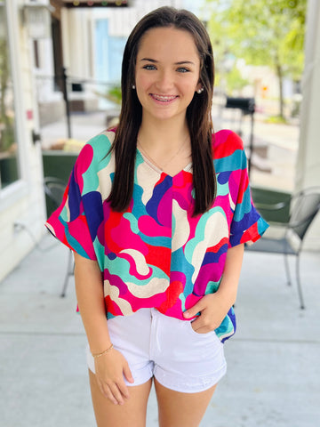 Fashionably Late Geometric Top