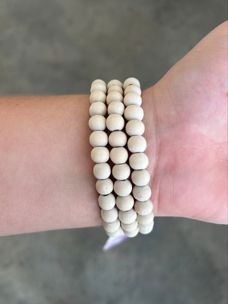 White Set of Three Stretch Bracelets Featuring Wood Beads With Natural Stone Bead Details