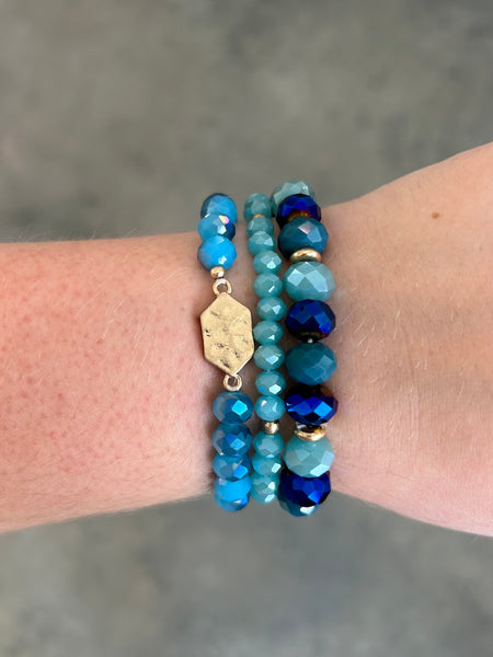 Blue Set of Three Stretch Bracelet With Faced Beads and Hammered metal charm