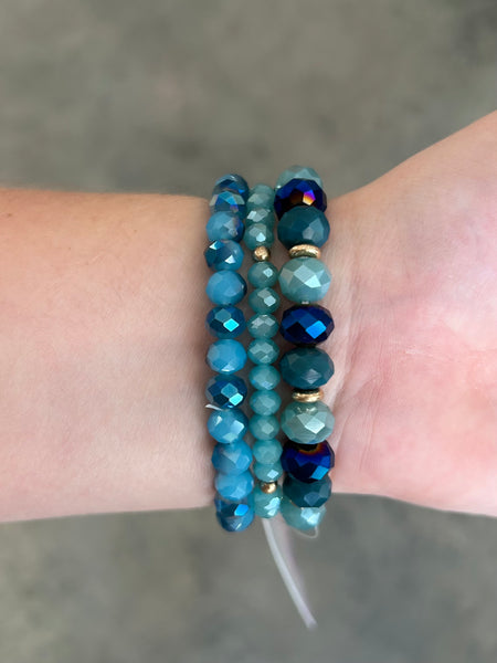 Blue Set of Three Stretch Bracelet With Faced Beads and Hammered metal charm