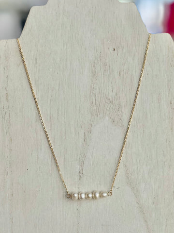 Simple Gold Necklace Featuring Pearl Accents